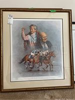 Full view of framed Fred Stone horse racing print showing the jockeys, horses, and two portraits above them.