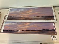 Two identical prints placed one on top of the other, one with white matting and the other plain, showing the artwork and signature area.