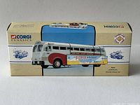 Box of the Corgi Classics Champlain Yellow Coach 743 Diecast Bus showing branding, model name and promotional artwork.