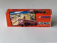 Side view of the boxed diecast model with colorful graphics and Corgi Classics branding