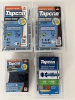 Photo showing four packs of Tapcon concrete anchors in original packaging, labeled with sizes and quantities.