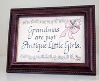 Front view of Babbling Brook 4x6 wooden photo frame containing decorative print with floral border and pink bow, text reads 'Grandmas are just Antique Little Girls'.