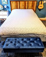 Photo of queen size bed with vintage white crochet coverlet fully spread, showing overall size and drape on bed.