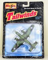 Front view of sealed packaging showing Maisto brand, Tailwinds series logo, and visible camo B25J Mitchell Bomber model inside clear plastic blister.