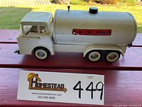 Side profile view of the white pressed steel tanker truck showing 'Ny-Lint Street Sprinkler' decal