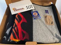 Blanket folded in box showing partial design and tag