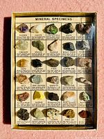 Photo of the full boxed set of 30 mineral specimens displayed with printed descriptions and original box.