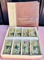 Full view of vintage Galaxy Beverage set box with 8 glasses inside showing leaf motif decoration and original packaging