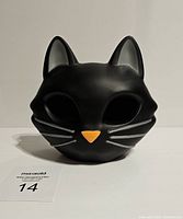 Front view of the modern black cat light showing facial details and shape