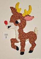 Full frontal view of vintage Rudolph wall decor made from melted popcorn plastic, showing front legs raised.