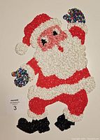 Front view of vintage Santa Melted Popcorn wall decor showing multicolored gloves, red suit, white beard, and black boots.
