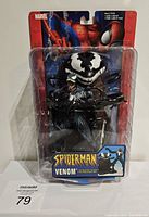 Front view of Toy Biz Venom figure in sealed plastic packaging showing detailed figure and Spider-Man header card.