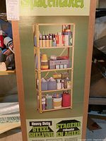 Photo of boxed shelving unit depicting product packaging and branding 'Spacemaker' Heavy Duty Steel Shelving.