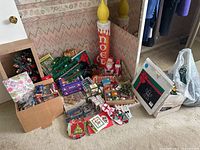 Overall view of the collection showing boxes, novelty candle decorations, and assorted ornaments.