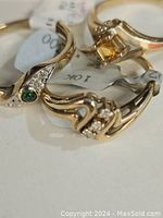 Three gold rings overlapping, showing overall shapes and colors