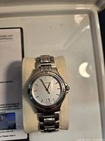 Watch displayed on cushion inside presentation box