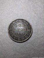 Reverse side of the 1882 Canada One Cent coin with denomination and date surrounded by a wreath.