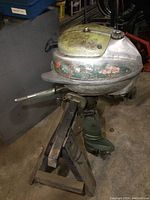 Side view of Johnson Seahorse outboard motor, showing tank, pull start, and mounting bracket.