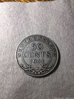 Reverse side of the 1911 Newfoundland silver coin showing denomination and year with decorative design