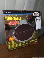 Front of original boxed Atlas HO Scale Turntable showing product image and key features.