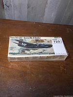 Photo of unopened Hasegawa model kit box featuring a twin-engine bomber aircraft illustration.