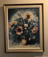 Full view of oil on canvas painting depicting sunflowers in a vase within a layered gold and beige frame.