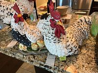 Front angle showing both rooster figures, detailed feather pattern and chicks at base