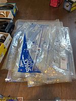 Four Ziploc Space Bag vacuum storage bags laid out, showing clear plastic material and large size.