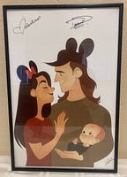 Full view of framed print showing cartoon couple and baby, signed with printed signatures.