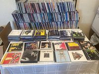 Front view of table displaying sample CD front covers including pop and rock titles