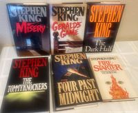 Front view of six Stephen King hardcover books with dust jackets, titles shown.