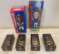 Six bobbleheads including Jeff Garcia hand painted, 2002 Drew Bledsoe NFL Edition, and four Barry Bonds mini-bobbleheads from Carl's Jr. 2003 all in original packaging.