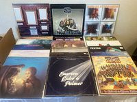 Photo showing a selection of vintage progressive rock vinyl records in their original sleeves, including albums by Emerson Lake & Palmer, Moody Blues, and others.