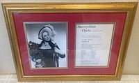 Frontal view of the framed display with signed photo of Renata Tebaldi and opera program.