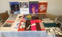 Photo of music books including Bob Dylan The 30th Anniversary Concert Celebration, The Groovy Years, and 100 Greatest Hits of Rock and Roll