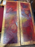 Two vertical rectangular canvas panels side-by-side showing abstract art in warm colors with leaf motifs, signed 'Pilaire' at bottom edge.