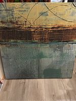 Full view of the abstract canvas wall art showing geometric and linear layered textures in earth tones.