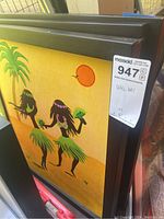 Three framed wall art paintings stacked showing silhouetted hula dancers, palm tree, and sun with bright yellow background.
