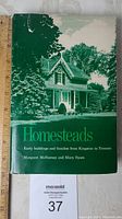 Front cover of dust jacket showing historic house image and book title.