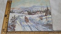 Photo showing entire 8 x 10 inch unframed oil painting on canvas board depicting a winter landscape with horse-drawn sleigh and houses under snow.