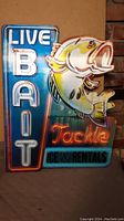 Photo of neon sign showing 'LIVE BAIT Tackle CE & Rentals' with a fish graphic