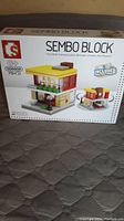 Front view of the Sembo Block set box showing the brand, age recommendation (6+), set number (106623), and the McDonald's themed design on the box.