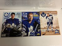 Photo showing the front covers of 3 Toronto Maple Leafs NHL yearbooks from mid-late 1990s featuring Felix Potvin and Mats Sundin.