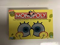 Closed game box showing SpongeBob SquarePants face and Monopoly logo