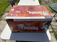 Closed box showing branding and feature layout of the digital home theater system with DVD, receiver, music center and surround sound speakers.