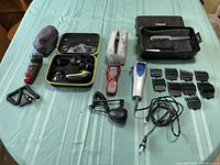 Full view of all items laid out including shavers, trimmers, cords, and cases