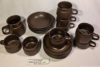 Full set laid out showing cups, bowls, saucers, and pitchers with label showing Denby Mayflower Breakfast Set Brown Ceramic Pottery