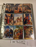 Page showing nine Magic The Gathering artist cards with colorful fantasy art by Elmore and Parkinson, depicting dragons, warriors, and battles.