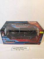 Clear view of the boxed black Maisto Pro Rodz 1970 Dodge Challenger RT Coupe model with box graphics and price sticker visible.