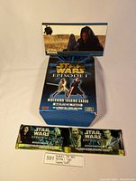 Blue box labeled Star Wars Episode 1 Widevision Trading Cards Series Two with unopened and a single pack of trading cards.